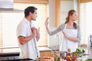 Young couple arguing in the kitchen